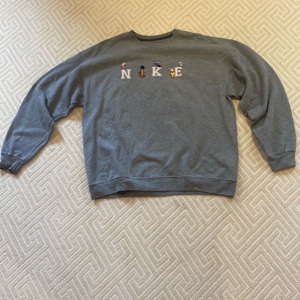 Oversized Gray Crewneck with Winnie the Pooh characters spelling out ‘NiKE’